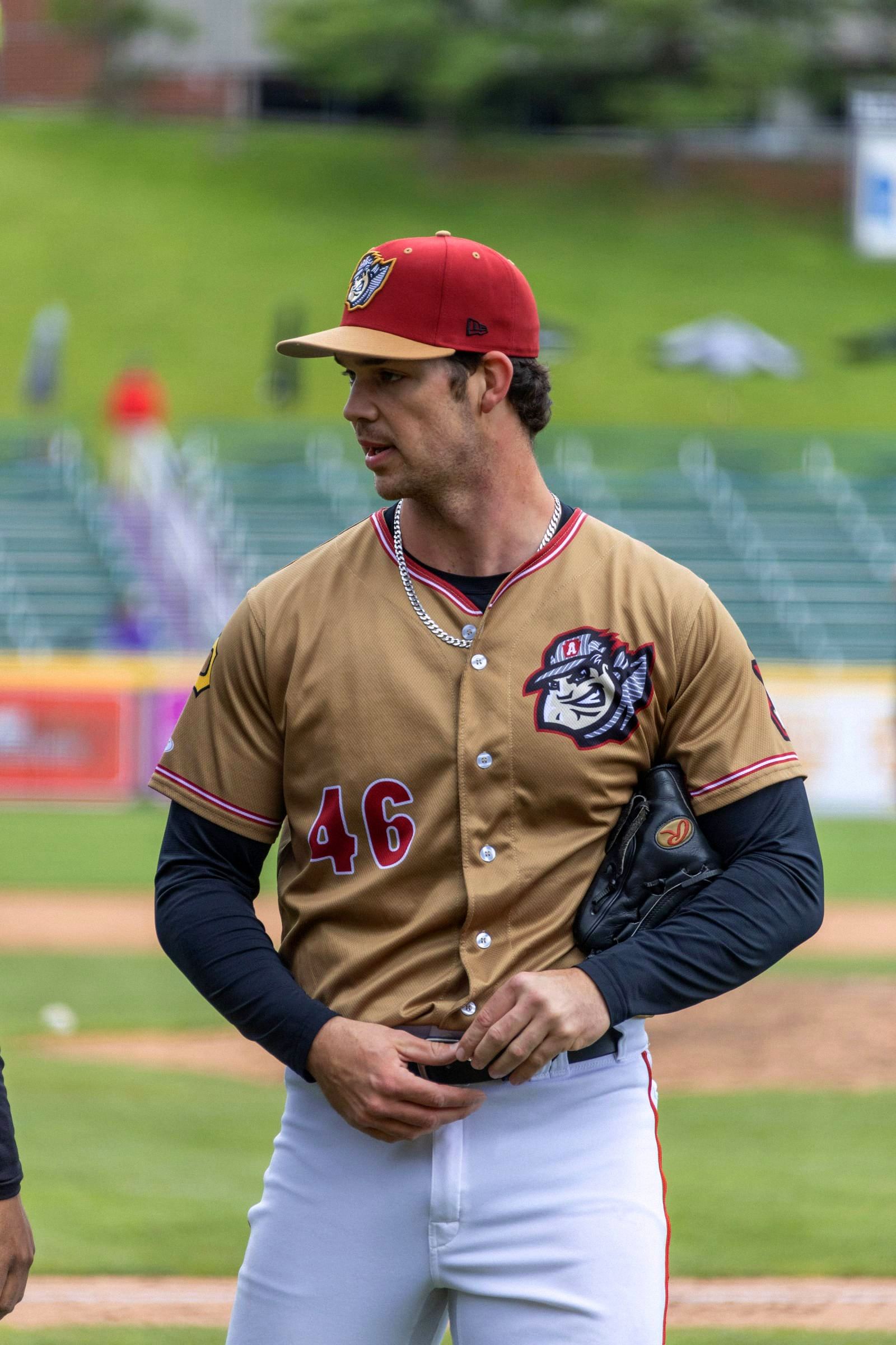 Jarod Bayless in a gold throwback jersey, between innings